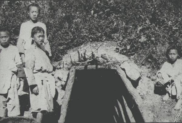 PRIMITIVE COAL-MINING IN Y&Uuml;N-NAN

Coal is abundant in many parts of Y&uuml;n-nan, though production is small and
methods of mining very crude. Picture shows tunnel leading underground.