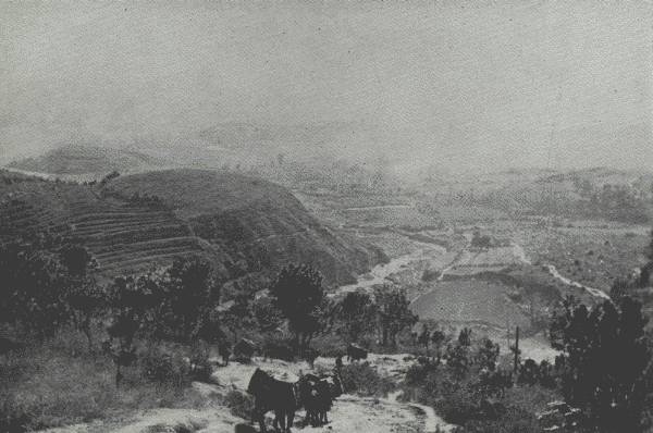 TWO DAYS OUT FROM YUNGCHANGFU

An almost everyday scene in the western part of China—China's
"Switzerland"—on the main road from Chung-king to Upper Burma.