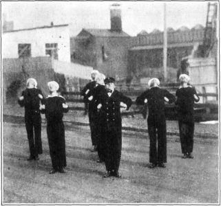 FIG. 9. &mdash; CURL

In the "Curl" position the head and shoulders should be thrown well back
and the fists should go well up into the armpits. Keep the elbows back
so that the entire thorax is lifted forward and up; at the same time
take a deep inhalation.