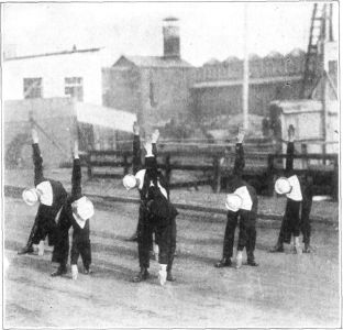 FIG. 14.&mdash;WEAVE

In the "Weave" care should be taken that the arms and shoulders are kept
in one line. The turn begins with the arms horizontal until they are
nearly at right angles to the "Cross" position. Then the knee commences
to bend and the body bends at the trunk, the hip turning in until the
finger tips touch the floor. At that time the arms and shoulders should
still be in the same relative position as at the start&mdash;namely, in
"Cross" position.