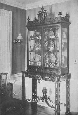 The dripping-water effect, of which Chippendale was so
fond at one time, is plainly shown on the doors of this particularly
 fine example of his work.