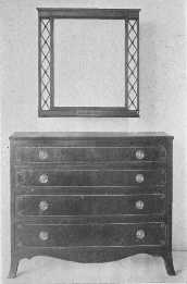 An exceptionally fine reproduction of a Sheraton chest of
drawers.
