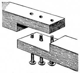 Fig. 220.&mdash;Lapped Scarf Joint with Bolts for
Heavy Timber.