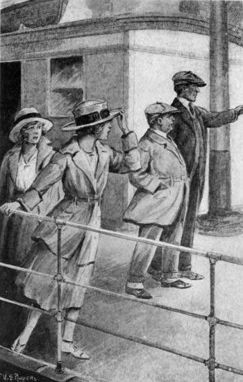 Nan's eyes were following the figures of two men
strolling down the deck. (See page 140)