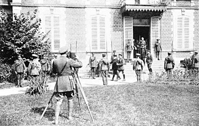 FILMING THE KING DURING HIS VISIT TO FRANCE IN 1916. HE IS ACCOMPANIED BY PRESIDENT POINCAR&Eacute;,
SIR DOUGLAS HAIG, GENERAL JOFFRE AND GENERAL FOCH