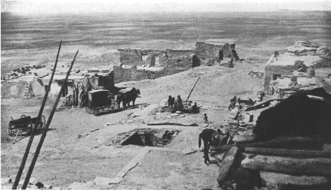 On top of the world&mdash;a Moki city on a Mesa in the Painted
Desert. At the left are the ends of a ladder leading from an underground
council chamber