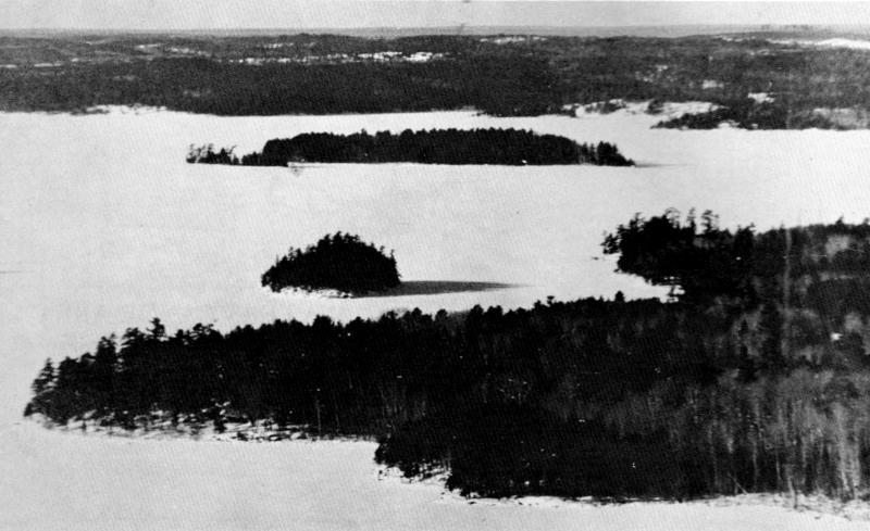 Figure 3.&mdash;Ridges, islands, swamps, and bays are part of the variable topography
in the Superior National Forest. (Photo courtesy of L. D. Mech.)