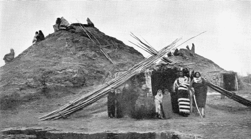 LODGES IN THE PAWNEE VILLAGE WHICH STOOD ON THE LOUPE FORK OF THE PLATTE RIVER

Photograph by W. H. Jackson, 1871