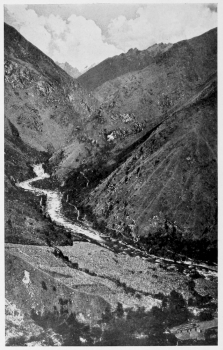 From the sugar cane, Urubanba Valley, at Colpani. On the
northeastern border of the Cordillera Vilcapampa looking upstream. In the
extreme background and thirteen sixteens of an inch from the top of the picture
is the sharp peak of Salcantay. Only the lower end of the more open portion
of the Canyon of Torontoy is here shown. There is a field of sugar cane in the
foreground and the valley trail is shown on the opposite side of the river.