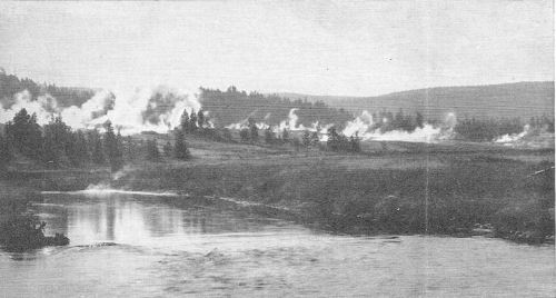 Across the Firehole River clouds of drifting steam mark the Firehole Geyser Basin&mdash;another reason why beautiful Yellowstone is the most photographed of our National Parks.