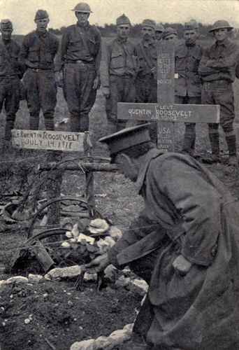 Colonel Barker placing the
commander&rsquo;s flowers on Lieutenant Quentin Roosevelt&rsquo;s grave